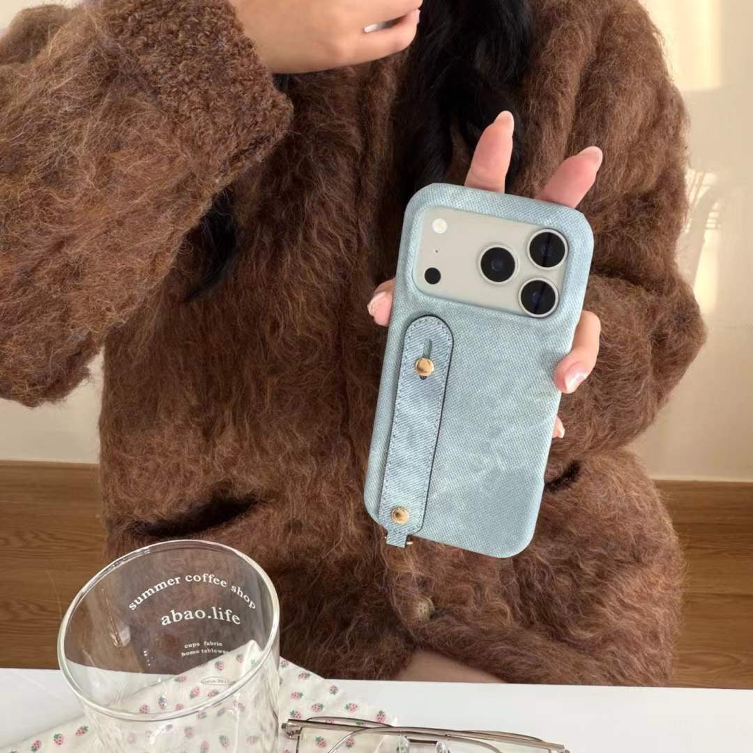 Modern Denim Finish Phone Case with Secure Hand Strap Design